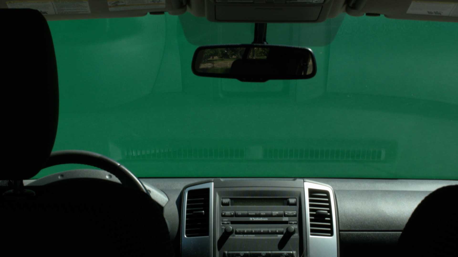 Inside vehicle seeing green screen outside in front