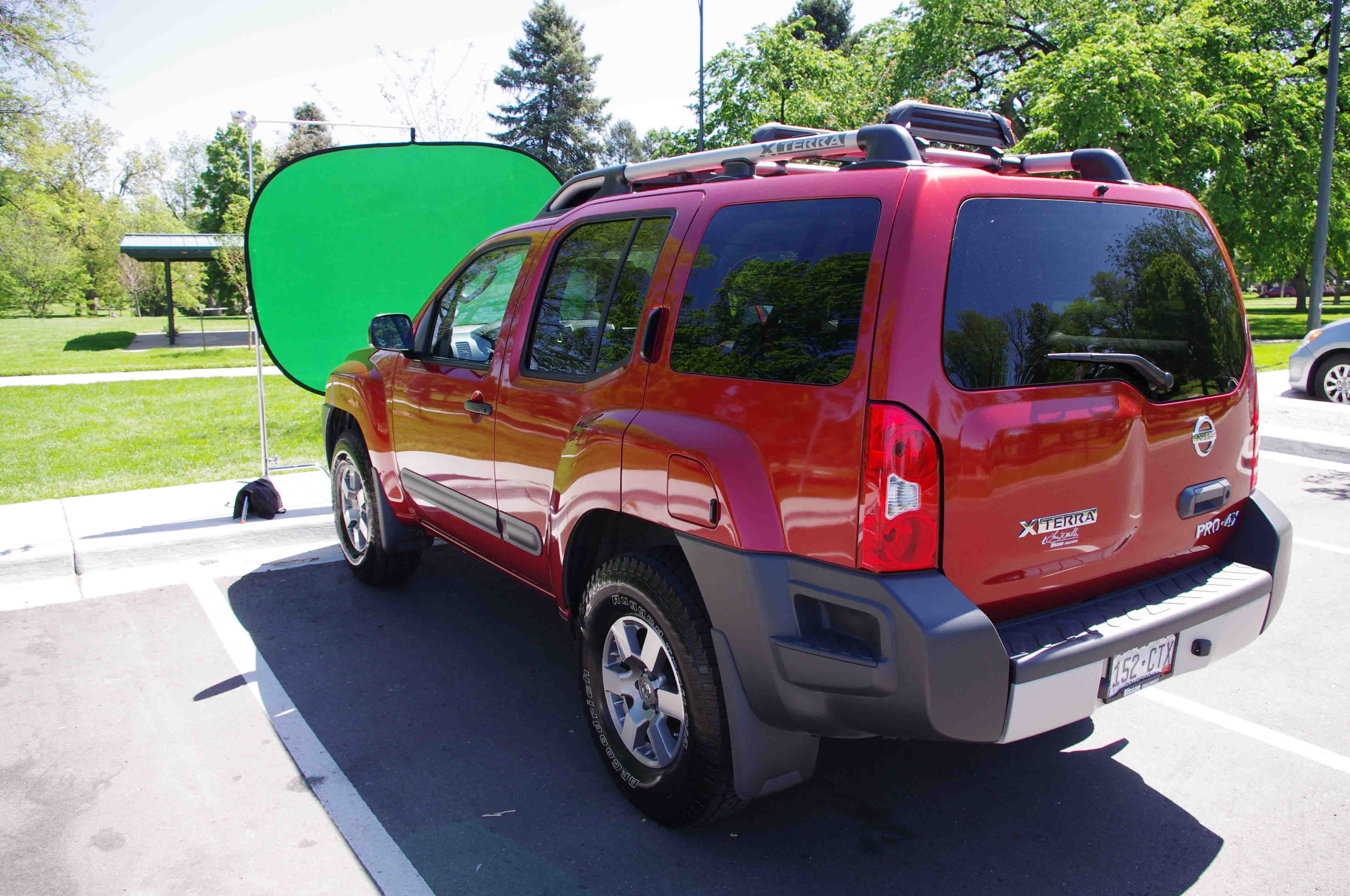 Vehicle with green screen in front of windshield