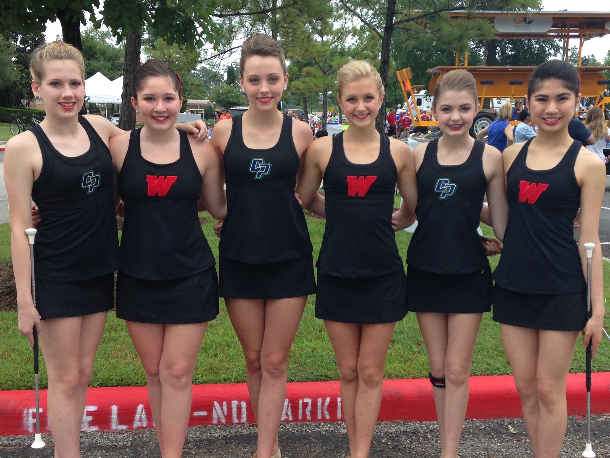 Local Feature twirlers for the two Woodlands high schools: (L to R) Rachel Hutchinson-CPHS, Jillian Romaguera-TWHS, Lindsay Richards-CPHS, Lindsey McCormick-TWHS, Allie Pellerito-CPHS and Isabel Obias-TWHS