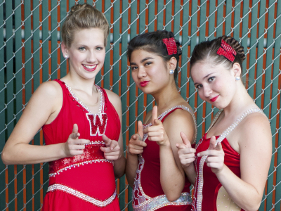 The three 2014 Feature Twirlers at The Woodlands High School: (L to R) Sophomore Rachel Hutchinson, Junior Isabel Obias and Junior Jillian Romaguera.